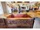 Close-up of a kitchen sink with granite countertops and custom copper basin at 7875 Berry Manor Ln, Edisto Island, SC 29438