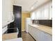 Efficient kitchen features white cabinetry, tile backsplash, and modern appliances at 7935 Edgebrook Cir # 2202, North Charleston, SC 29418