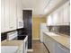 Efficient kitchen features white cabinetry, tile backsplash, and modern appliances at 7935 Edgebrook Cir # 2202, North Charleston, SC 29418