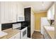Efficient kitchen features white cabinetry, tile backsplash, and modern appliances at 7935 Edgebrook Cir # 2202, North Charleston, SC 29418