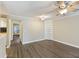 Open living room featuring sleek wood floors and built-in shelving at 7935 Edgebrook Cir # 2202, North Charleston, SC 29418