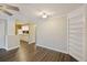 Inviting living room with hardwood floors, and built-in shelves, transitioning to kitchen at 7935 Edgebrook Cir # 2202, North Charleston, SC 29418