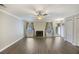 Bright living room with wood floors, fireplace, and multiple windows at 7935 Edgebrook Cir # 2202, North Charleston, SC 29418