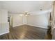 Bright living room featuring modern wood floors and classic built-in shelving at 7935 Edgebrook Cir # 2202, North Charleston, SC 29418
