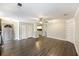Open living space with wood floors, ceiling fan, and access to the kitchen at 7935 Edgebrook Cir # 2202, North Charleston, SC 29418