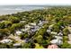 Panoramic aerial view of a neighborhood with lush trees, waterfront views, and a bridge at 930 Richter Way, Mount Pleasant, SC 29464