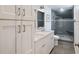 A modern bathroom with dual sinks and a glass-enclosed tiled shower at 930 Richter Way, Mount Pleasant, SC 29464
