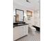 Bathroom features a black and white tile floor, a claw foot tub, and white vanity at 930 Richter Way, Mount Pleasant, SC 29464