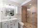 Bathroom with walk-in shower, white vanity, and a large mirror at 930 Richter Way, Mount Pleasant, SC 29464