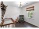 Brightly lit bedroom featuring a stylish ceiling light, a wicker giraffe, and a zebra head at 930 Richter Way, Mount Pleasant, SC 29464