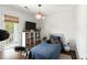 Cozy bedroom featuring a single bed, white shelving unit, and stylish wicker light fixture at 930 Richter Way, Mount Pleasant, SC 29464
