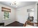Brightly lit bedroom features a stylish ceiling light and a view into the hallway at 930 Richter Way, Mount Pleasant, SC 29464