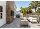 Outdoor wooden deck featuring comfortable lounge chairs, dining area, and fenced backyard at 930 Richter Way, Mount Pleasant, SC 29464