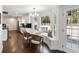 Open concept kitchen and dining area with stainless appliances, white cabinetry, and breakfast nook at 930 Richter Way, Mount Pleasant, SC 29464