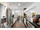 Bright, modern kitchen with stainless steel appliances, dark countertops, and hardwood floors at 930 Richter Way, Mount Pleasant, SC 29464