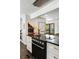 Well-appointed kitchen featuring stainless steel appliances, a gas range, a bar area, and plenty of counter space at 930 Richter Way, Mount Pleasant, SC 29464