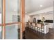 Bright, open kitchen featuring a large island with seating, stainless steel appliances, and dark hardwood floors at 930 Richter Way, Mount Pleasant, SC 29464