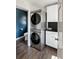 Functional laundry room with stacked washer/dryer and storage cabinets at 930 Richter Way, Mount Pleasant, SC 29464