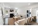 Cozy living room featuring a fireplace, neutral decor, and access to the outdoor deck at 930 Richter Way, Mount Pleasant, SC 29464