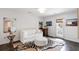 Bright living room featuring a white sofa, zebra-print rug, hardwood floors, and a walkout to the back yard at 930 Richter Way, Mount Pleasant, SC 29464