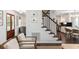 Inviting living room with a staircase and lots of natural light at 930 Richter Way, Mount Pleasant, SC 29464