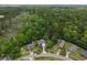 A picturesque neighborhood boasts homes nestled among verdant trees and lush foliage at 1061 Reverend Joseph Heyward Rd, Charleston, SC 29414