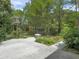 Expansive backyard patio featuring lush greenery, offering an ideal setting for outdoor relaxation and entertainment at 1061 Reverend Joseph Heyward Rd, Charleston, SC 29414