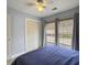 Cozy bedroom with natural light, a double closet, and a ceiling fan at 1061 Reverend Joseph Heyward Rd, Charleston, SC 29414