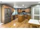 Bright kitchen with wood cabinets, granite countertops, and stainless appliances at 1061 Reverend Joseph Heyward Rd, Charleston, SC 29414