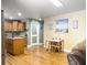 Bright kitchen with wood cabinets, granite countertops, and a functional breakfast area at 1061 Reverend Joseph Heyward Rd, Charleston, SC 29414