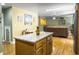 Open-concept kitchen showcasing granite counters, wood cabinets, and modern appliances at 1061 Reverend Joseph Heyward Rd, Charleston, SC 29414