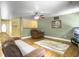 Inviting living room featuring hardwood floors, comfortable seating, and a ceiling fan at 1061 Reverend Joseph Heyward Rd, Charleston, SC 29414