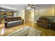 Open-concept living area showcasing hardwood floors, comfortable seating, and stylish decor at 1061 Reverend Joseph Heyward Rd, Charleston, SC 29414