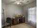 Well-lit home office with a ship model, wooden desk, and a large window at 1061 Reverend Joseph Heyward Rd, Charleston, SC 29414