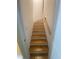 A bright staircase features natural wood steps with white risers and a matching handrail at 1061 Reverend Joseph Heyward Rd, Charleston, SC 29414