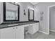Bathroom featuring double sinks, vanity with black countertops, and marble floors at 112 Riviera Dr, Summerville, SC 29483