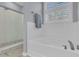 Bright bathroom featuring a soaking tub and separate glass-enclosed shower with tiled surround and marble flooring at 112 Riviera Dr, Summerville, SC 29483