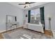 Bright bedroom with a ceiling fan, daybed, mirrored vanity, and beautiful area rug at 112 Riviera Dr, Summerville, SC 29483