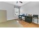 Spare bedroom with a window, ceiling fan and minimalist furnishings. Features both carpet and hardwood flooring at 112 Riviera Dr, Summerville, SC 29483