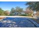 Well-maintained clubhouse with a white exterior, surrounded by manicured landscaping and trees at 112 Riviera Dr, Summerville, SC 29483