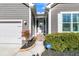 Inviting home entrance with covered porch, white trim, and lush landscaping for added curb appeal at 112 Riviera Dr, Summerville, SC 29483
