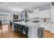 Kitchen featuring a spacious island with seating, white cabinets, and stainless steel appliances at 112 Riviera Dr, Summerville, SC 29483