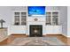 Inviting living room showcasing fireplace with built-in shelving and hardwood flooring at 112 Riviera Dr, Summerville, SC 29483