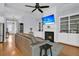 Spacious living room features hardwood floors, fireplace with built-in shelving, and modern ceiling fan at 112 Riviera Dr, Summerville, SC 29483