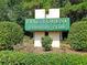 The Pine Forest Country Club sign is surrounded by manicured landscaping, marking the entrance to a premier community at 112 Riviera Dr, Summerville, SC 29483