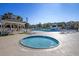 Hot tub beside large swimming pool featuring lap lanes, gazebo, lounge chairs, and landscaping at 112 Riviera Dr, Summerville, SC 29483