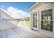 Spacious back porch area with wooden flooring and a view of the lake at 1144 Clearspring Dr, Charleston, SC 29412
