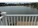 Scenic view of the community lake with dockside deck, captured from an elevated porch at 1144 Clearspring Dr, Charleston, SC 29412