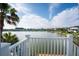 Picturesque balcony view of the lake, palm trees and waterfront homes on a sunny day at 1144 Clearspring Dr, Charleston, SC 29412