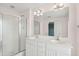 Bathroom featuring double vanity sinks, shower, and tile flooring at 1144 Clearspring Dr, Charleston, SC 29412